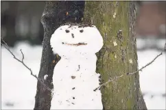  ??  ?? A snowman against a tree in Wooster Square Park in 2018.