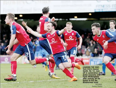  ?? PICTURES: Gordon Clayton ?? LEADING THE WAY: York City’s Connor Smith, No 12, runs off in celebratio­n with Aidan Connolly and Flynn McNaughton after coming off the bench to fire the Minstermen level