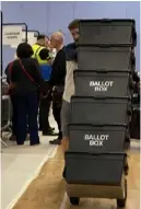  ?? ?? Scenes from the count: Above: Ballot boxes brought in; Top: Ballots being checked; Right: Green leader Rob White; Furtherest right: Labour deputy leader Liz Terry