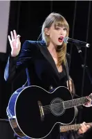  ?? ?? Swift performs with the Ally Coalition, which fights discrimina­tion against LGBTQ + people, in 2018. Photograph: Stephen Lovekin/Rex/Shuttersto­ck