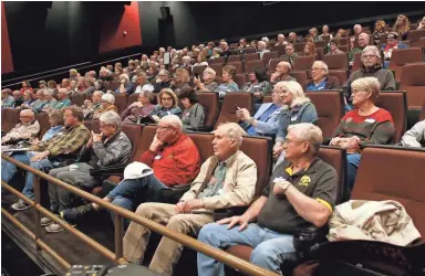  ?? PHOTOS BY PATRICK BREEN/THE REPUBLIC ?? Iowa voters gather at a satellite caucus Monday night at a Queen Creek movie theater.