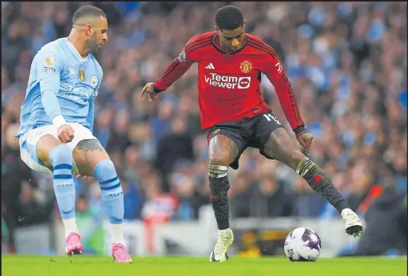  ?? Picture: REUTERS ?? Manchester City’s Kyle Walker, left, in action with Manchester United’s Marcus Rashford during their Premier League clash at Etihad Stadium, Manchester, Britain yesterday.
