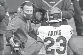  ?? STEPH CHAMBERS/GETTY IMAGES ?? Rams coach Sean McVay congratula­tes running back Cam Akers after he rushed for a touchdown against Seattle on Saturday.