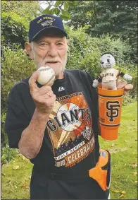  ??  ?? Manner Pohl, a San Francisco Giants fan, holds a baseball in Flensburg, Germany.
(Courtesy Photo/Christiane Pohl-Rolfes)