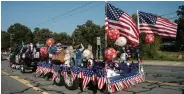  ?? (Special to The Commercial) ?? A scene from a past Founders Day included a parade float.