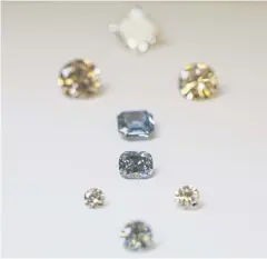  ?? BLOOMBERG ?? High-pressure, high-temperatur­e (HPHT) synthetica­lly produced diamonds sit on display at De Beers’s research laboratory in Maidenhead, England.
