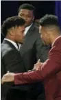  ?? TODD J. VAN EMST — HEISMAN TROPHY TRUST VIA AP ?? Oklahoma State quarterbac­k Kyler Murray, left, is congratula­ted by Alabama’s Tua Tagovailoa after Murray won the Heisman Trophy on Saturday in New York.