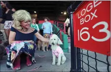  ?? STAFF PHOTO BY MATT STONE ?? Phyllis Kassels of Newton with her poodle Daisy, during Dogs on Deck: A Barktail Party with MSPCA-Angell at Fenway Park on Wednesday, June 21, 2017 at City Hall Plaza.