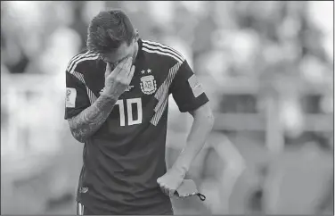  ?? Associated Press ?? Disappoint­ment: Argentina's Lionel Messi covers his face during the group D match between Argentina and Iceland at the 2018 soccer World Cup in the Spartak Stadium in Moscow, Russia, Saturday.