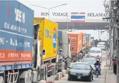  ??  ?? Traffic at the Sadao border checkpoint is congested, though the Thai government is planning special economic zones in the district bordering Malaysia.