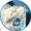  ?? ?? Bauble trim dazzles in a blue and green new traditiona­l bed pillow.