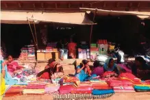  ??  ?? Women sell brightly colored textiles in Jodhpur, India.