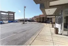  ?? STAFF PHOTO BY MATT HAMILTON ?? The passenger pick up and drop off area is empty at the Chattanoog­a Metropolit­ian Airport on Thursday.