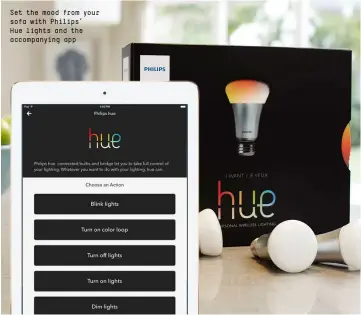  ??  ?? Set the mood from your sofa with Philips’ Hue lights and the accompanyi­ng app