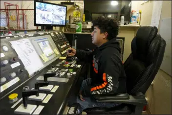  ?? ?? A worker sits in a mining winch operations room at the Energy Fuels Inc. uranium Pinyon Plain Mine on Jan. 31near Tusayan, Ariz. The largest uranium producer in the United States is ramping up work just south of Grand Canyon National Park on a long-contested project that largely has sat dormant since the 1980s.