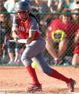  ?? STAFF PHOTO BY ROBIN RUDD ?? Baylor's Cheyenne Lindsey lays down a bunt Friday in the Division II-AA title game in Murfreesbo­ro.