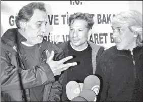  ?? The Associated Press ?? NBC chief foreign correspond­ent Richard Engel, center, NBC Turkey reporter Aziz Akyavas, left, and NBC photograph­er John Kooistra speak during a news conference in Reyhanli, Turkey, Tuesday.