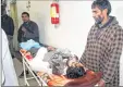  ??  ?? An injured civilian being taken for treatment at SMHS hospital in Srinagar on Sunday.