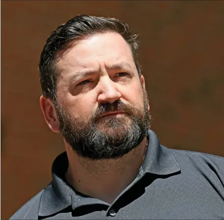  ?? MATT STONE/BOSTON HERALD ?? Former MBTA police sergeant David Finnerty 47, of Rutland stands outside federal court after his arraignmen­t on Thursday in Boston. Finnerty was arrested by federal agents for allegedly falsifying police reports to cover for another officer who pleaded guilty to assaulting a man in July 2018.