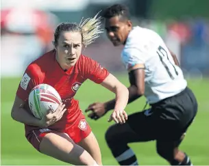  ?? FRANCOIS NEL GETTY IMAGES ?? Julia Greenshiel­d had three tries — all against Fiji — as Canada put up three victories on the opening day of the Emirates Airline Dubai Rugby Sevens on Thursday.