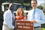  ?? Contribute­d photo ?? State Sen. Matt Lesser, DMiddletow­n, right, and state Rep. Quentin Phipps, DMiddletow­n, left, participat­e in a highway sign unveiling ceremony at Veterans Memorial Park in Middletown, honoring the state’s veterans.