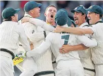 ??  ?? Australia players celebrate retaining the Ashes.