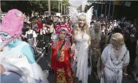  ??  ?? Crowds at a Pride parade in Taipei yesterday. In the past 200 days Taiwan’s only Covid cases have been among people arriving from abroad. Photograph: Chiang Ying-ying/AP