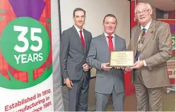  ?? Picture: Steven Brown. ?? Fife Provost Jim Leishman, right, presents an award to Mark Cameron, centre, and Timothy Coors.