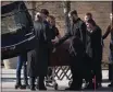  ?? SARAHBETH MANEY — FOR THE ASSOCIATED PRESS ?? Relatives and loved ones gather around the casket of Michigan State University shooting victim Alexandria Verner, 20, after a funeral Mass at the Guardian Angels Catholic Church in Clawson, Mich., on Saturday.