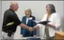  ??  ?? North Coventry police Officer Victor Machese was one of 28 Chester County law enforcemen­t officers who took part in crisis interventi­on training this week. He accepts his certificat­e from Chester County Commission­er Kathi Cozzone. Watching is Caroline...