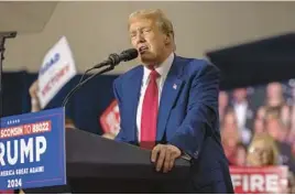  ?? MIKE ROEMER/AP ?? Former President Donald Trump speaks at a rally Tuesday in Green Bay, Wisconsin. The trial in the first of four criminal cases he is facing is scheduled to begin April 15.