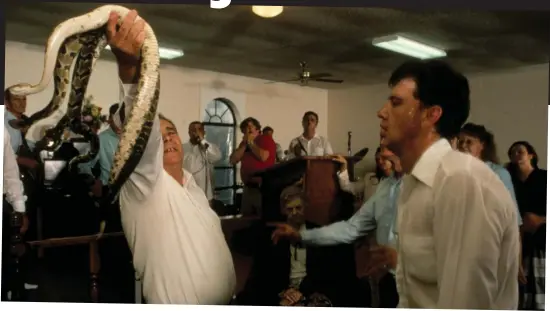  ?? Pictures: ?? Test of faith: Serpent-handling devotees at a service in Georgia — where the practice is now banned