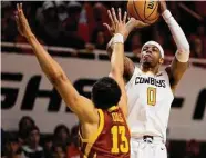  ?? Mitch Alcala/Associated Press ?? Avery Anderson III scored 18 points to help lead Oklahoma State to a win over No. 12 Iowa State.