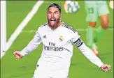  ??  ?? Sergio Ramos converted a late penalty in Real Madrid’s 1-0 win over Getafe that sent them four points clear of Barcelona.