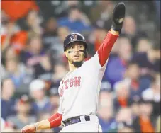  ?? Elsa / Getty Images ?? The Red Sox’s Mookie Betts reacts after scoring during an ALCS game against the Astros last season.