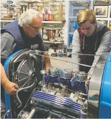 ??  ?? Ken Bayko says the cancellati­on of car shows presents an opportunit­y to upgrade his 1932 Ford pickup truck hot rod with grandson Brian Rickard.