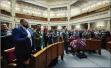  ?? ?? Members of the Verkhovna Rada display the British flag in the chamber