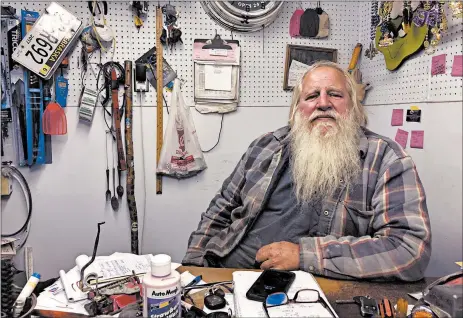  ?? GRANT SCHULTE/AP ?? Danny Rice, shown at his auto repair shop Nov. 9 in Elmwood, Nebraska, isn’t particular­ly concerned if he contracts the coronaviru­s. “If I get it, I get it,” the 67-year-old said.