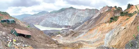  ?? — AFP photos ?? In this file panoramic view photo taken with a smartphone on July 4, the site of a deadly landslide in an area where miners work in open-cast jade mines is seen near Hpakant in Kachin state.