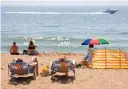  ?? PA ?? Sunbathers enjoy the hot spell in Bournemout­h, Dorset, yesterday