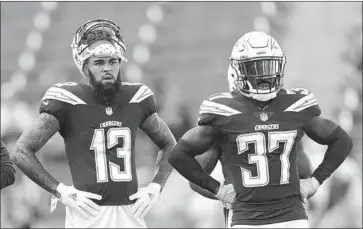  ?? Marcio Jose Sanchez Associated Press ?? CHARGER Jahleel Addae, right, on the sideline with Keenan Allen during preseason game against New Orleans, remembers the importance of the last game of the 2013 preseason, notably because he made the roster.