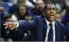  ??  ?? Connecticu­t head coach Kevin Ollie yells to his teamearlie­r this season. Yelling was not going to help Thursday as the Huskies struggled to close out Temple, watching the Owls end the game with an 18-2run.