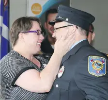  ??  ?? Jennifer Svenson, left, who suffered an electrical shock in February 2017, thanks first responder John Halsey of Kingsville Fire and Rescue.