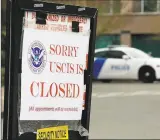  ?? Getty Images ?? A sign indicates the closure of a Department of Homeland Security building due to an employee who may be infected with the coronaviru­s in Tukwila, Wash.