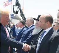  ??  ?? EDUCATION MINISTER Naftali Bennett (right) greets US President Donald Trump upon his arrival in Israel last May.