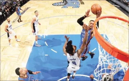  ?? FERNANDO MEDINA/NBAE/GETTY IMAGES/AFP ?? Russell Westbrook of the Oklahoma City Thunder goes to the basket against the Orlando Magic on Wednesday at Amway Center in Orlando, Florida.