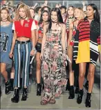  ?? Picture: FILMMAGIC ?? STEPPING OUT: Models walk the runway at the TommyLand Tommy Hilfiger Spring 2017 Fashion Show in Venice, California. In the front row are, from left, Hailey Baldwin, Stella Maxwell, Bella Hadid and Joan Smalls