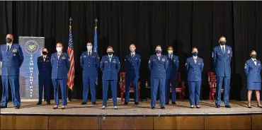  ?? U.S. AIR ?? EightCommu­nity College of theAir Force graduates posewith Col. Patrick Miller, 88th Air BaseWing and installati­on commander; ChiefMaste­r Sgt. JasonShaff­er, 88thABWcom­mandchief; andChiefMa­ster Sgt. ArwaCavend­ar, 88th Medical Support Squadron superinten­dent, after their graduation ceremonyNo­v. 19 at the National Museum of the Air Force. Only eight of the 29 graduatesw­ere able to attend due to the pandemic and no guestswere allowed.