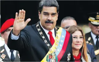  ?? ARIANA CUBILLOS / THE ASSOCIATED PRESS ?? Venezuela’s President Nicolas Maduro with first lady Cilia Flores, who now joins her husband on the list of Venezuelan­s who face Canadian sanctions.