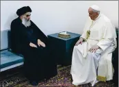  ?? VATICAN MEDIA — THE ASSOCIATED PRESS ?? Pope Francis, right, meets with Iraq’s leading Shiite cleric, Grand Ayatollah Ali al-Sistani in Najaf, Iraq, on Saturday.
